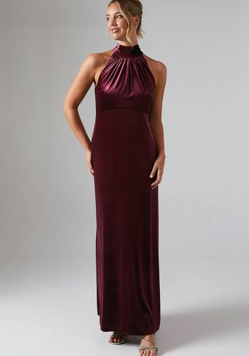 wine-coloured velvet winter bridesmaid dress, featuring elegant halterneck design with off-shoulder ruffle detail