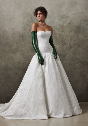 Strapless dropped waist ball gown wedding dress with tiny accent bows on back.