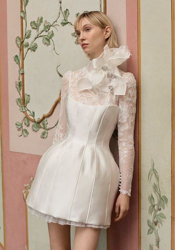 short wedding dress with long sleeve lace undershirt and statement neck detail