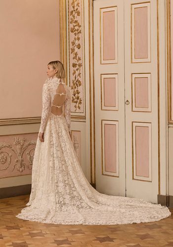 long sleeve lace wedding dress with open back and bow detailing