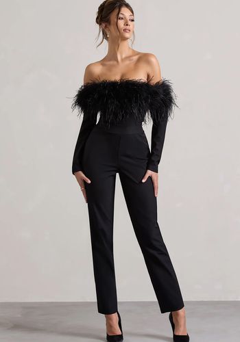 black bridal jumpsuit from club l london for alternative black bridal outfit. Jumpsuit features feather trim at neckline