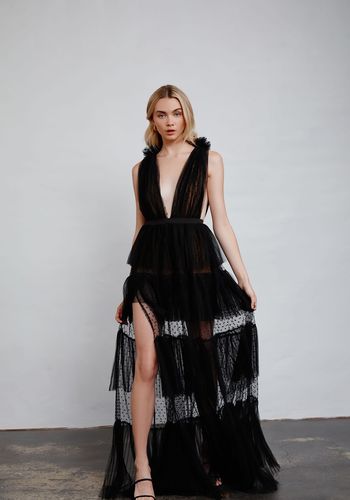 black wedding dress idea from wolf & badger, featuring layers of tulle ruffles, ruffle shoulder detail and lined mesh