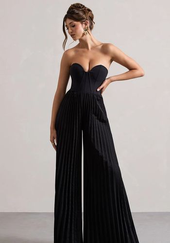 black wedding guest jumpsuit with structured corset bodice and wide plisse legs 