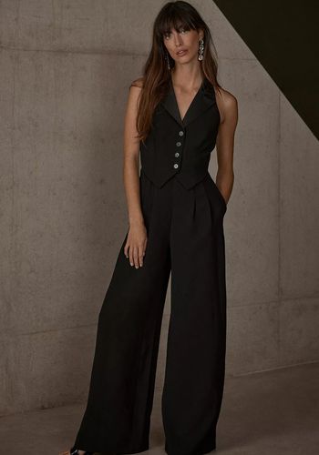 black sleeveless tuxedo wedding guest jumpsuit with wide leg silhouette.