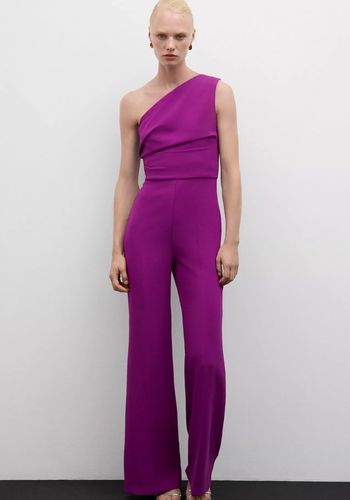 purple wedding guest jumpsuit with asymmetric neckline.