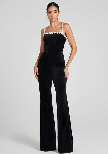 black velvet wedding guest jumpsuit with a bandeau neckline and pearl droplet embellishments. 