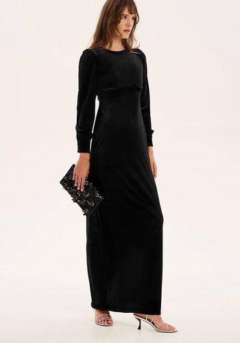 black velvet long sleeve wedding guest dress with open tie back detail.