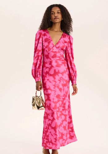 pink floral long sleeve wedding guest dress in blurred floral print. 