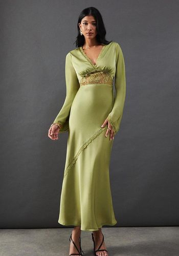 best long sleeve wedding guest dress in olive green with lace insert. 