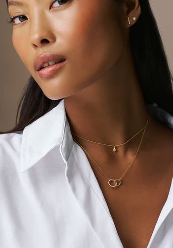 delicate bridal necklace with dainty gold chain, a Cubic Zirconia open circle, and additional interlocking embellished gold circle. 