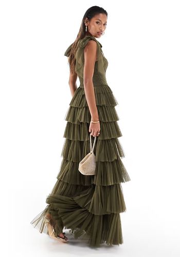 formal evening wedding guest dress in olive green with tiered tulle ruffle skirt design.