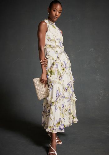 spring evening wedding guest dress in maxi silhouette featuring a crew neckline, ruffle detailing.