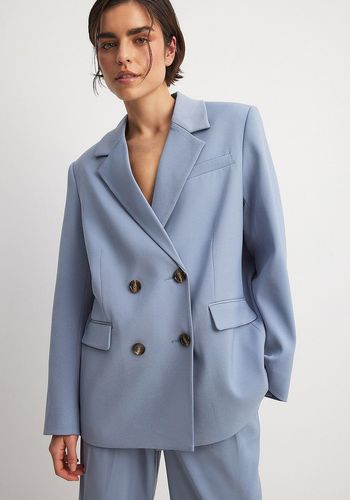 oversized wedding suit in a pale dusty blue colour for bridesmaids or guests