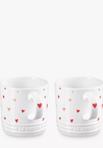 pair of white mugs from le creuset with red heart pattern as engagement gift idea