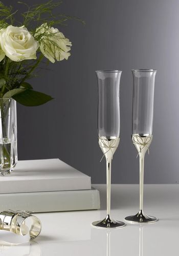 silver plated Vera Wang champagne flutes with elegant "love knot" bows as luxury engagement gift idea