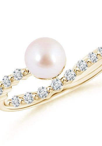 9k yellow gold solitaire ring is adorned with an Akoya cultured pearl with diamond accents.