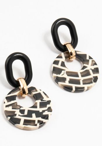 disc cut-out design earrings with black-and-white check pattern