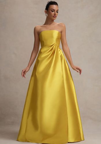 yellow wedding dress in mustard tone with bandeau neckline, structured bodice and volume skirt.