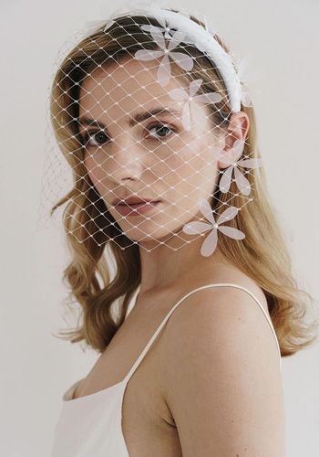 full face merrywidow veil on a lightly padded crepe hairband, with flower embellishments and pearls