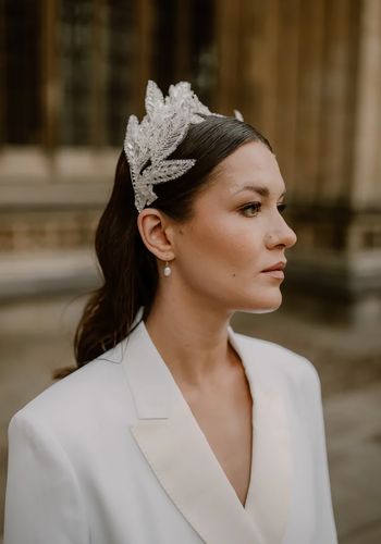 halo of intricately beaded iridescent leaves, shaped as a crown on a thin metal silver headband