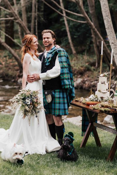 Scottish blue and green wedding inspiration with tartan kilts, a bagpiper, whiskey station and Scotty dogs.