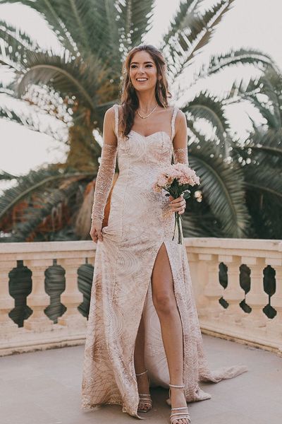 Carmen de los Mártires Spanish destination wedding with bespoke gold sparkly bridal gown with front slit