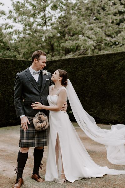 Pimhill Barn wedding with the groom in a kilt and bride in sparkly wedding dress.