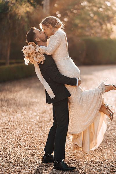 Bride and groom share a passionate and romantic kiss
