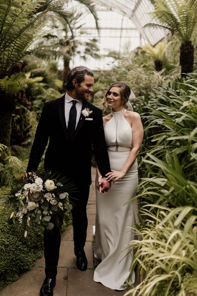 Elegant Tatton Park wedding with tropical flowers and halter neck dress