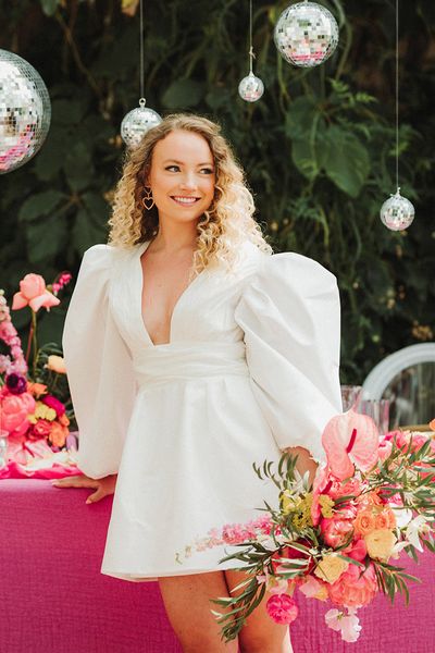 Polstrong Manor wedding with pink decor and bride in short puff sleeve wedding dress.