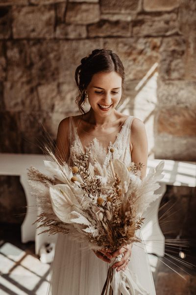 Bride with Dried Flower Wedding Bouquet