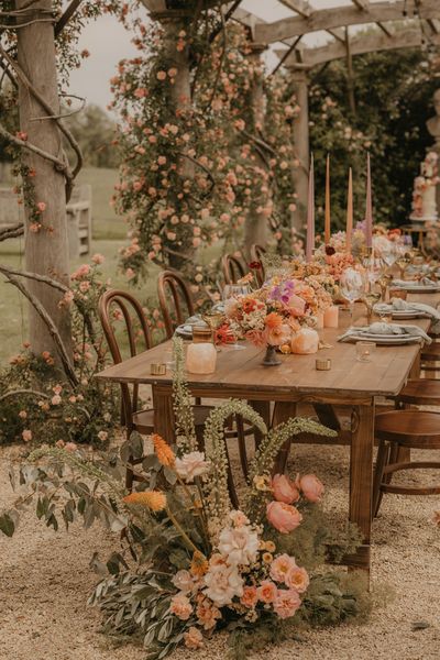 Summer wedding inspiration at Euridge Manor with orange, coral and peach wedding flowers and decor, and with Made With Love dresses