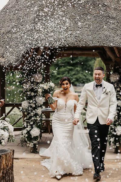 Bride and groom have confetti exit at The Orangery Kent.