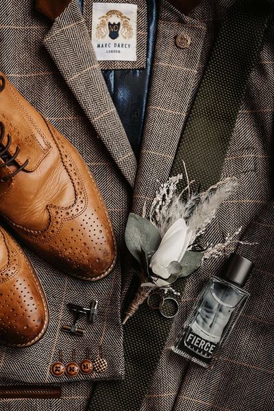 Groom accessories with the suit jacket, groom shoes, groom cologne and more.