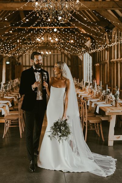 rustic barn wedding couple portrait for wedding insurance article