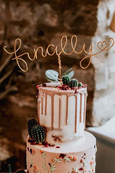 Unique wedding cake toppers including wire, laser-cut, figurines, and toys