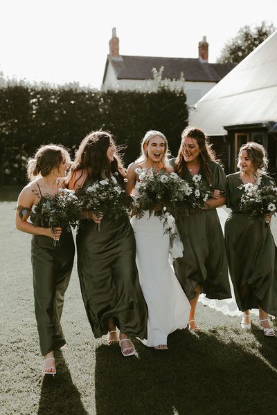 Dark green bridesmaid dresses for the bridal party at a traditional minimal wedding.