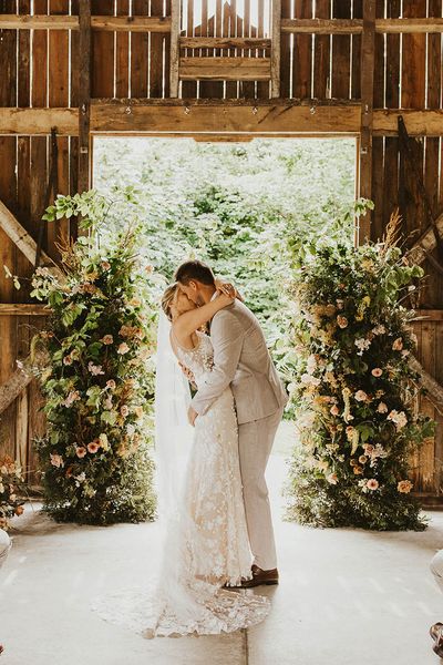 Bride and groom share their first kiss as a married couple at Nancarrow Farm.