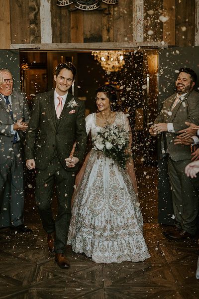 Wharfedale Grange wedding for multicultural couple as they exit to confetti