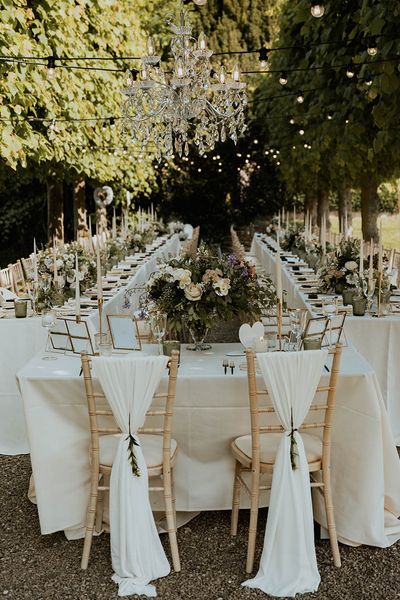 Sweetheart table for modern seating arrangement at outdoor wedding