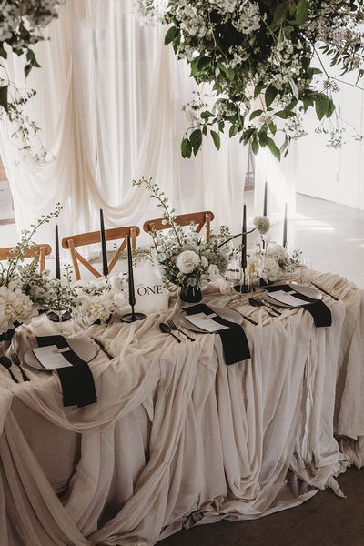 Black and white table setting for wedding at Willow Grange Farm.