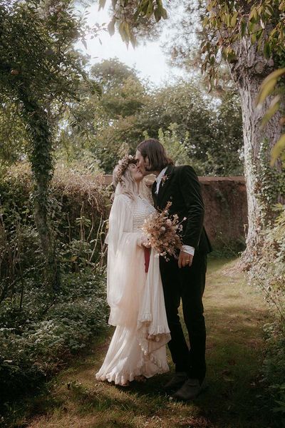 outdoor pagan wedding with vintage wedding dress and dried wedding flowers