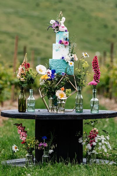 Colourful wedding inspiration at Little Wold Vineyard with wild flowers, buttercream cake and lace dresses 