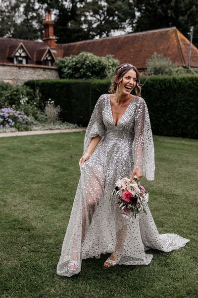 Silver sequin wedding dress, and gypsophila flower clouds for a marquee reception at home 