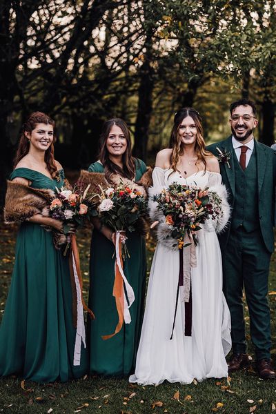 Forest green autumnal bridesmaid dresses for November wedding at Cripps Barn.