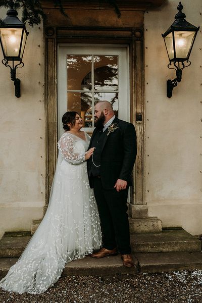 Groom in green tweed wedding suit with bride in lace dress at Aswarby Rectory.