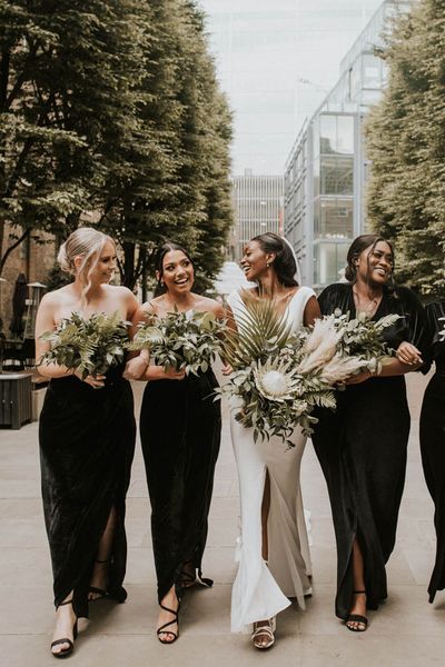 bridal-party-wearing-black-bridesmaid-dresses