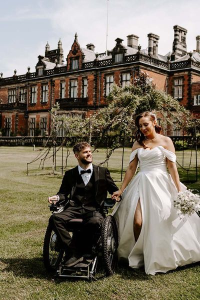 Italian-style accessible wedding at Capesthorne Hall with inter able couple, white flowers, lemons & floral napkins by Opperhill Photography