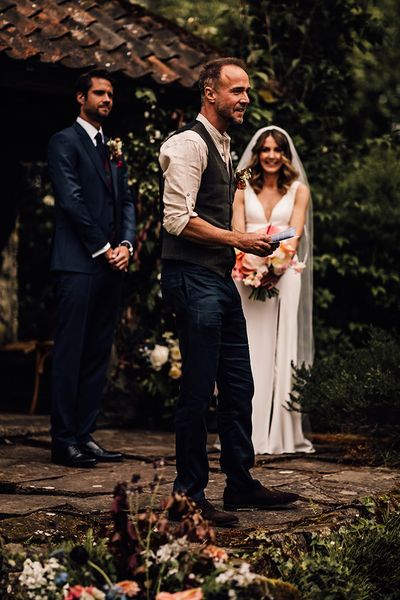 Guest gives a wedding reading from books.