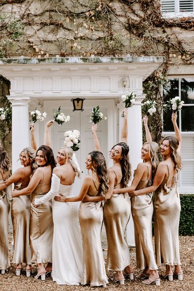 Black tie wedding at Northbrook Park with champagne gold bridesmaid dresses 